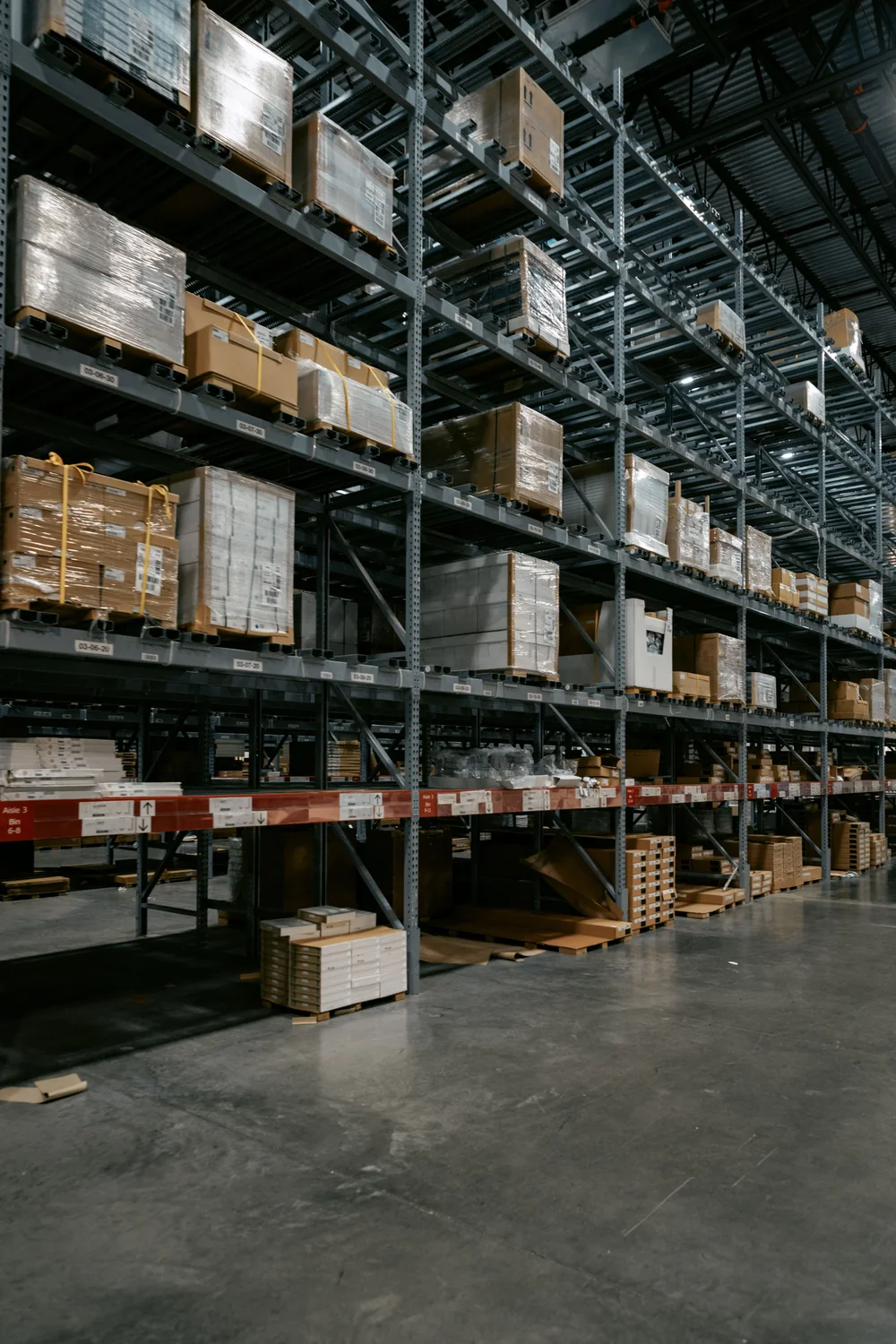 Organized warehouse storage racks holding palletized cargo
